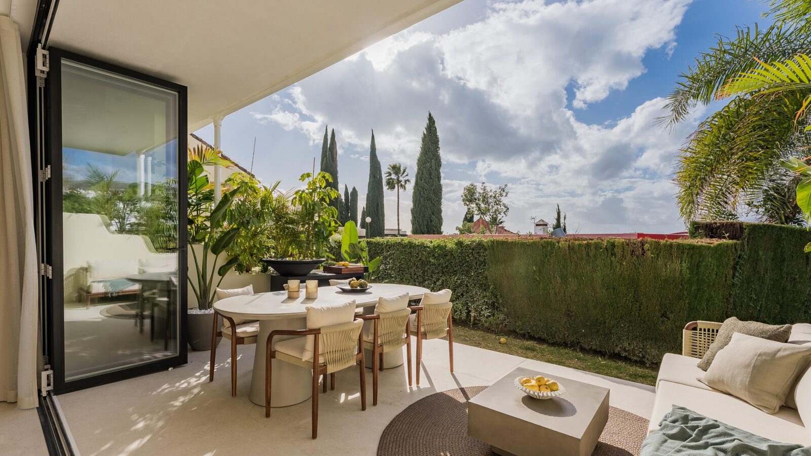 Casa Suma — garden terrace with outdoor dining